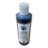 Bottle of coyote urine with a white cap on a white background